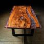 Preview: Ein wunderschöner Massivholztisch mit einem qualitativen Kunstharz auf einem Metallgestell